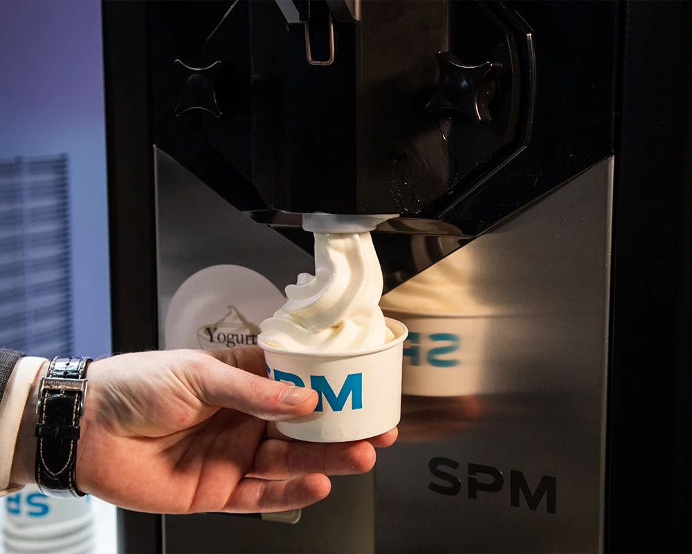 dispensing-soft-ice-cream-into-a-cup-from-a-Karma-machine-SPM-1000x800
